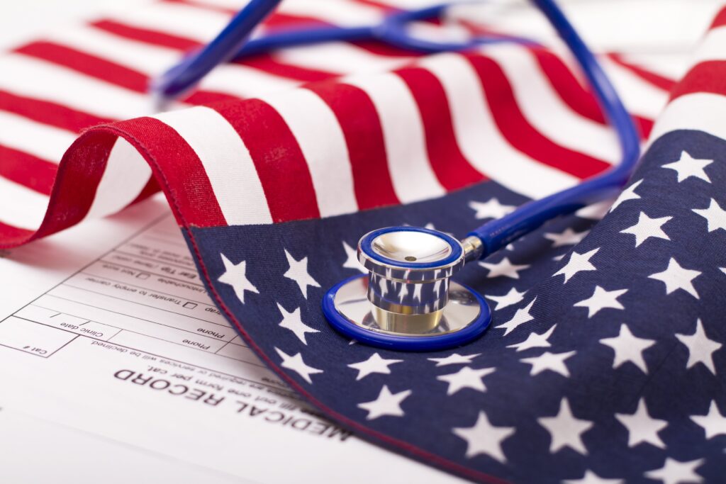 american flag resting under stethoscope